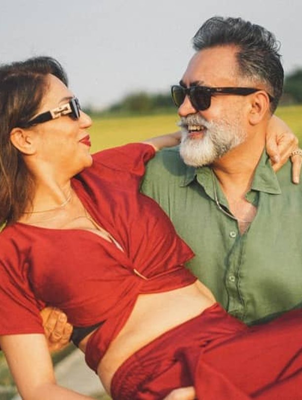Couple laughing together outdoors
